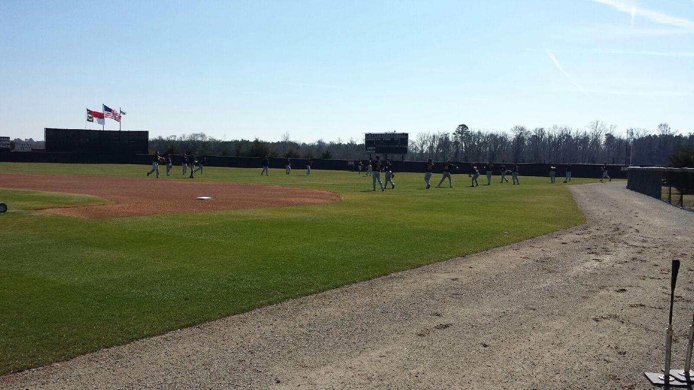The MCC baseball team warms up in Kinston, NC prior to the start of Monday's doubleheader with Lenoir CC