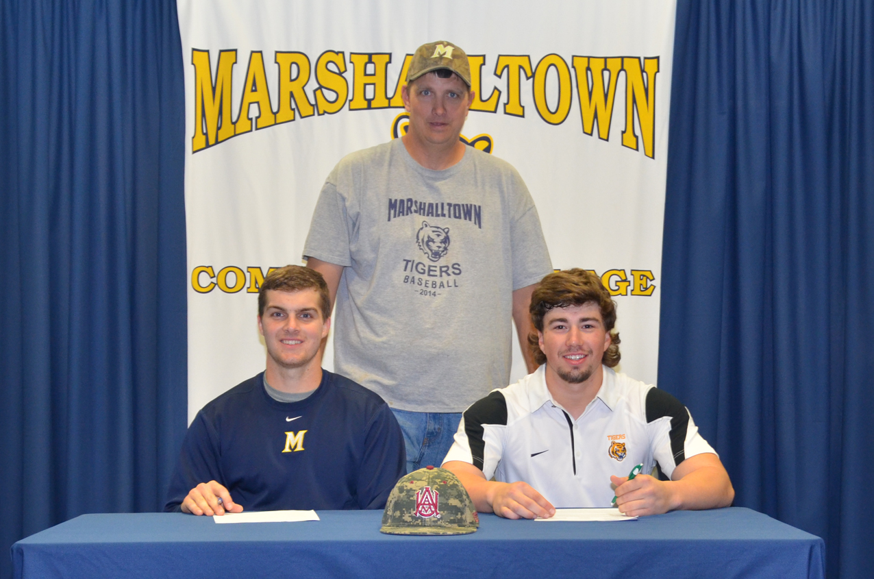 Kyle Herrick (left) and Ryan Thrasher join MCC head coach Rich Grife as the two sign their National Letter of Intent to play at Alabama A&M on Tuesday