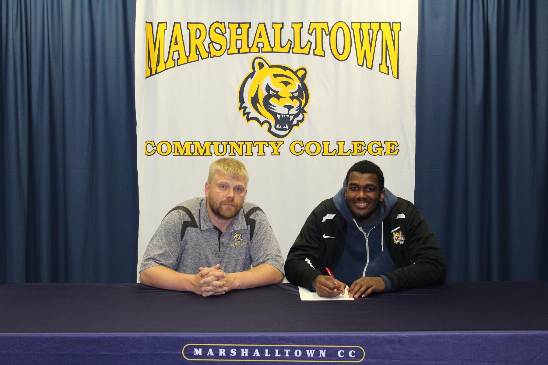 Amir Maddred, pictured with MCC head coach Brynjar Brynjarsson, signed a National Letter of Intent to play for Slippery Rock next season