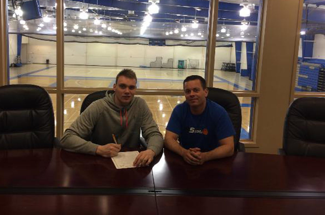 Paulius Sakinis, pictured with Peru State men's basketball coach Eric Behrens, has signed a National Letter of Intent with the Bobcats