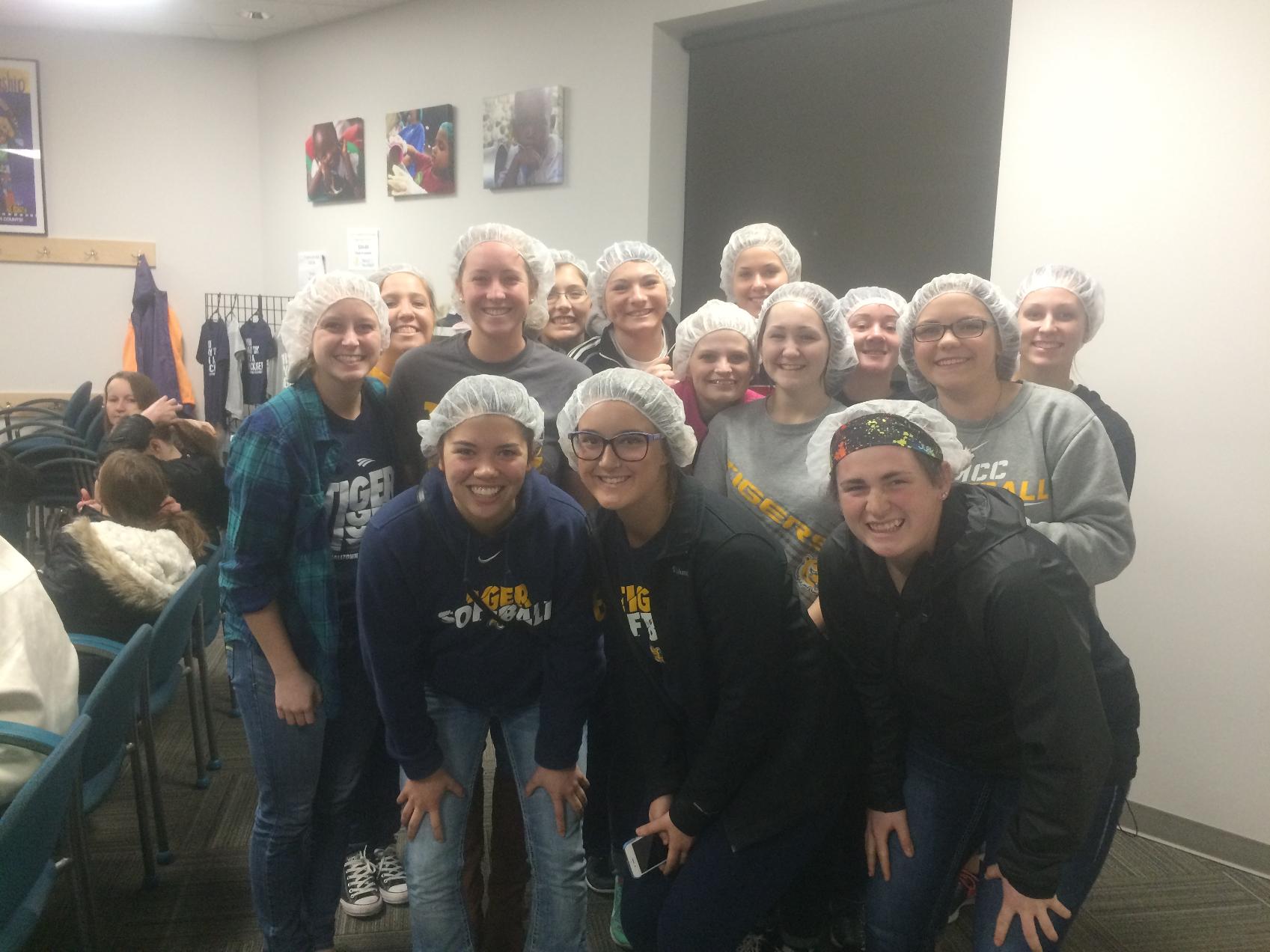 Softball pitches in with Meals from the Heartland