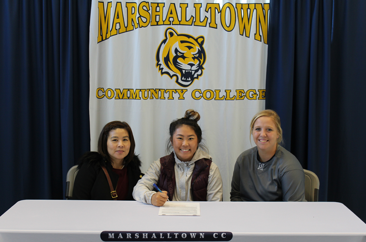 Anika Matsumoto, with her mother Ning (L), and MCC assistant coach Courtney Hopkins, signs a National Letter of Intent to join the Tiger softball program