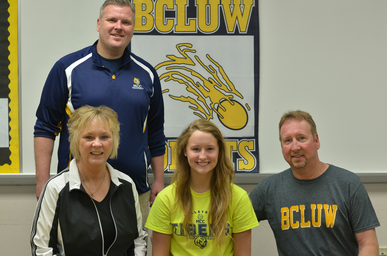 Nicole Montgomery, flanked by her parents Angie and Kevin, is joined by MCC head coach Chris Brees for the signing of her National Letter of Intent on Tuesday morning