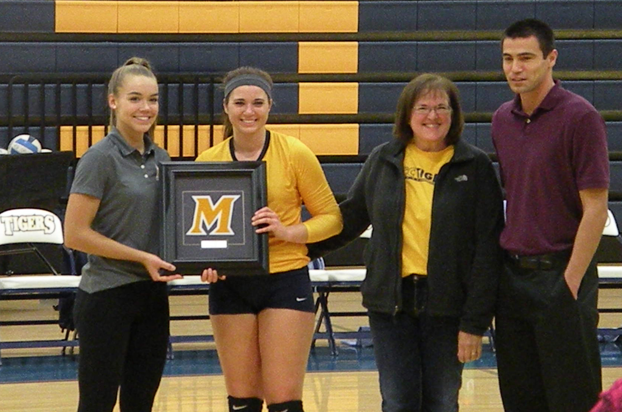 Lannie Dubberke, flanked by MCC assistant coach Mady Van Metre and head coach Peter Cruz, is joined by her mother, Wendy prior to the start of Sophomore Night on Thursday

(Photo credit: Lerin Dubberke)