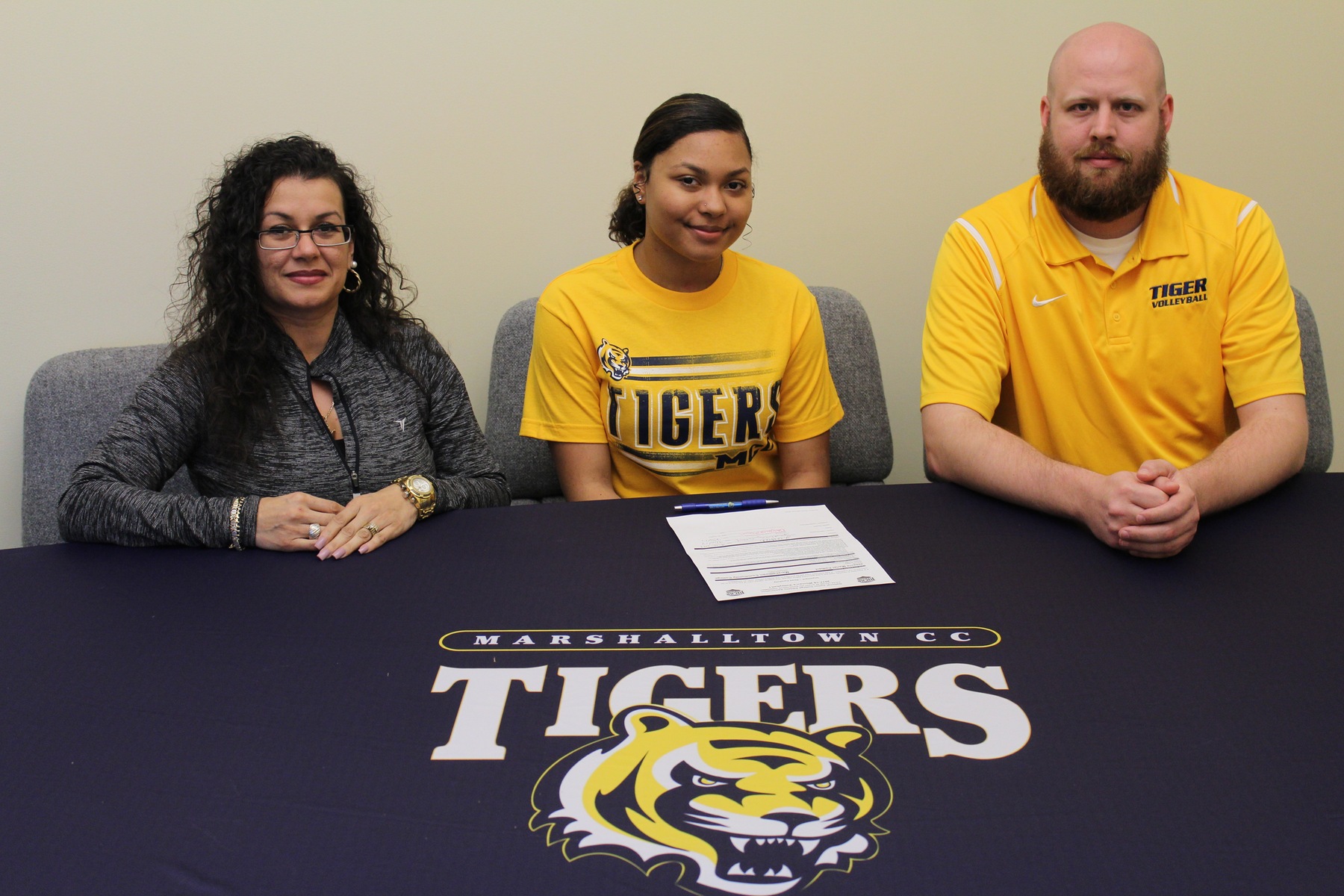 Jesenia Colbert, joined by her mother and MCC head coach Justin Hoskins, has signed to play for the MCC volleyball team next season