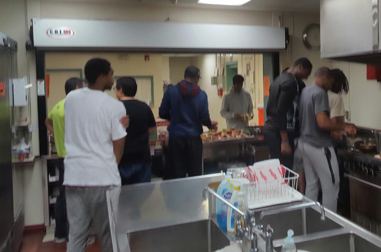 Men's Basketball volunteers at House of Compassion, Oktemberfest